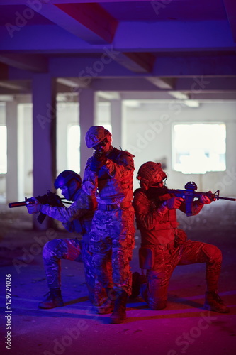 Soldiers squad in tactical formation having action urban environment © .shock