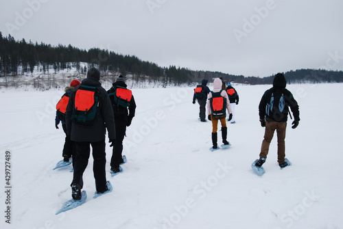 People in group walking on snow  photo