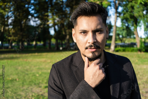 Landscape portrait of a young Latin American man. Copy space