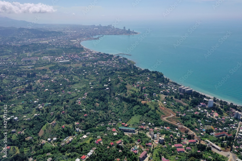 Naklejka premium view of the mountains and the city from a drone