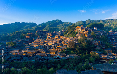 Dusk scenery of Qianhu Miao village in Xijiang, Qiandongnan, Guizhou Province, China © Weiming
