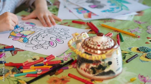 Wallpaper Mural Children. The hands of a little girl who carefully paints the drawing with colored pencils. Close-up shooting. Torontodigital.ca