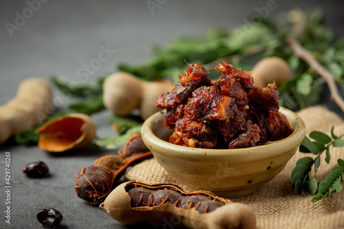 fresh sweet ripe tamarind on dark backgroud photo