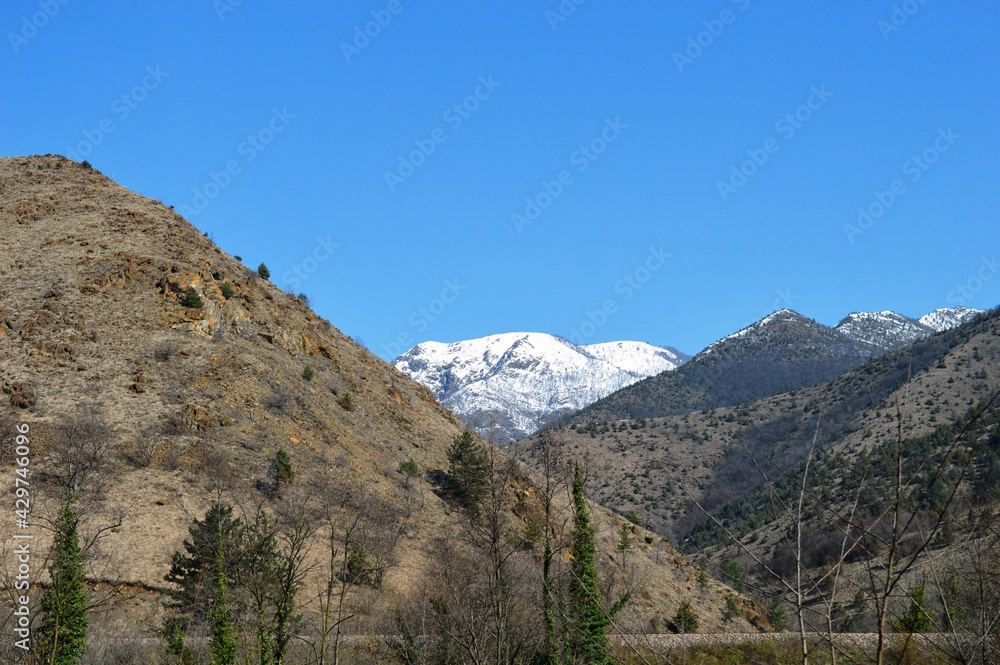a hill under the snow in the spring