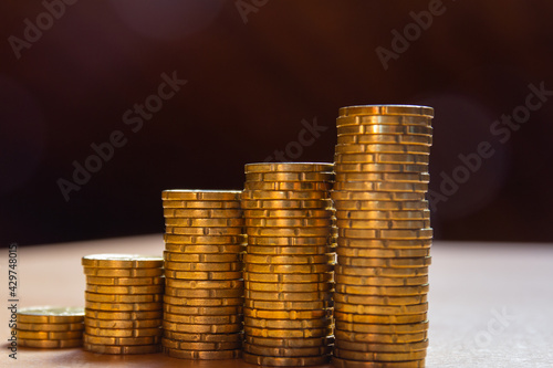 Close up view of five coin towers. Save money concept banner.