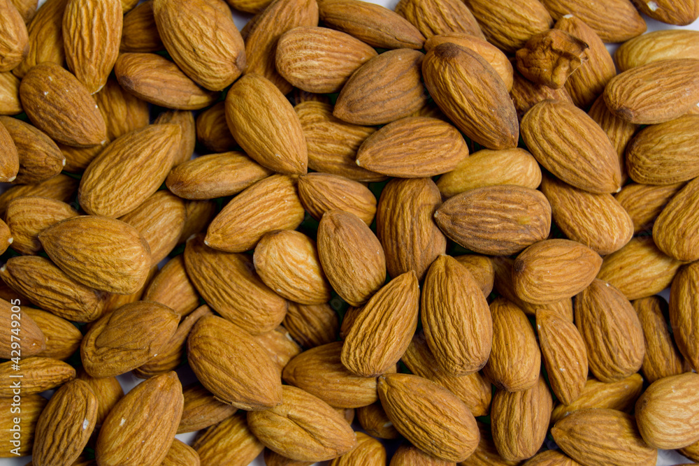 almonds close-up. nuts lie on a plane almonds close-up. nuts lie on a plane