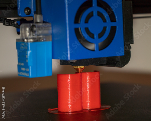 a 3d printer at work creating a custom 3d model