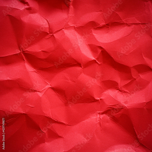 Red crumpled paper texture background 