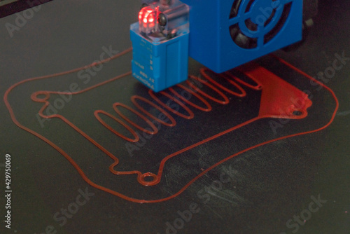 a 3d printer at work creating a custom 3d model