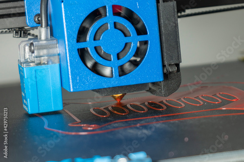 a 3d printer at work creating a custom 3d model