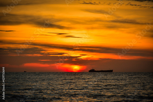 Beautiful sunset over an island, seaside © allPhoto Bangkok