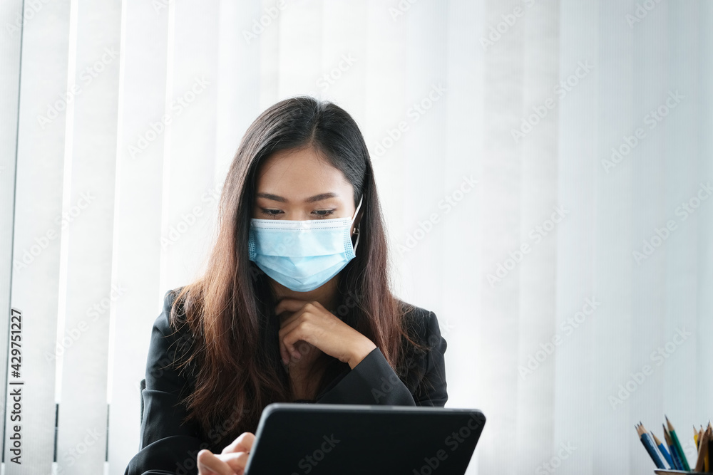 Business woman using tablet to review balance sheet annual using document and calculator to calculating budget. audit and Check integrity before investment concept. Business woman using tablet to review balance sheet annual using document and calculator to calculating budget. audit and Check integrity before investment concept.