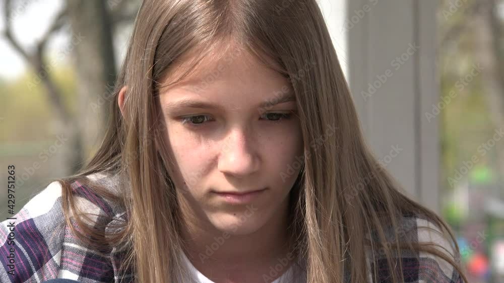 Sad Kid, Unhappy Child, Thoughtful Bullied Girl in Park, Depression of Adolescents, Children Expression in Coronavirus Pandemic Sad Kid, Unhappy Child, Thoughtful Bullied Girl in Park, Depression of Adolescents, Children Expression in Coronavirus Pandemic