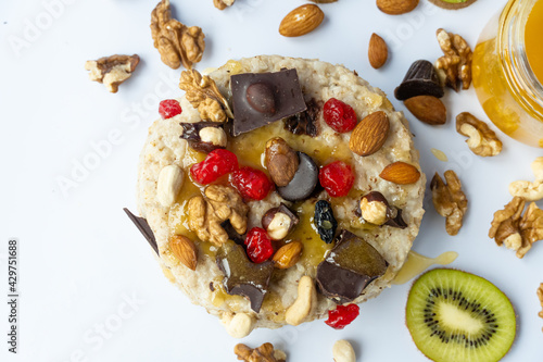 Oatmeal with fruit, chocolate and honey. Breakfast. photo