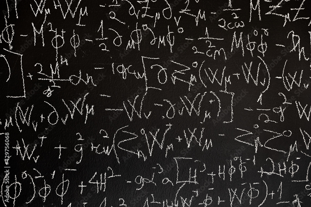 Mathematical formulas on dark black chalk board Mathematical formulas on dark black chalk board
