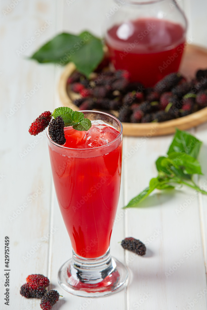 Mulberry juice on white wooden backgroud Mulberry juice on white wooden backgroud