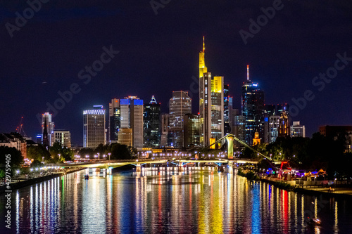FRANKFURT  GERMANY  25 JULY 2020 Modern cityscape of the business district with reflection on the Main river at night