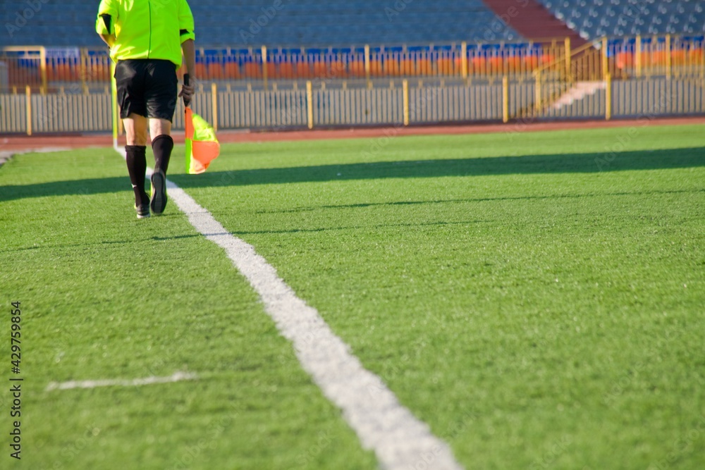 Fototapeta premium STADIUM - Football field with goal and tablo on blue sky