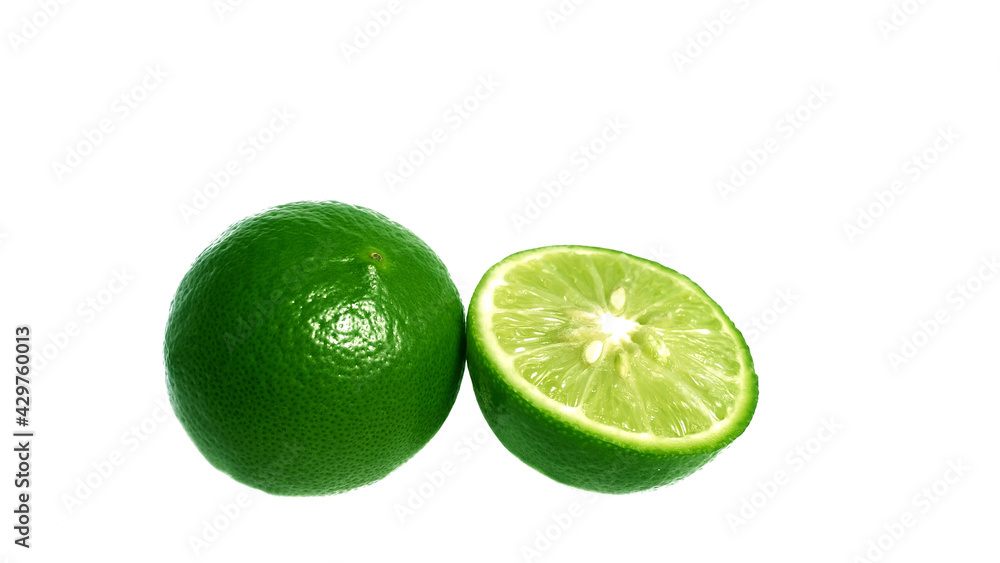Lime, green rind with leaves on the back, have separate parts. Can see the lemon pulp and seeds separately. On isolated on white background