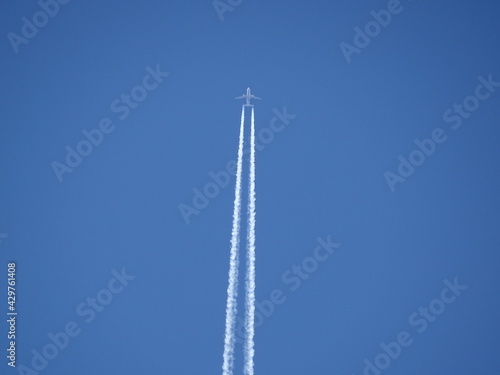 a plane in the blue sky