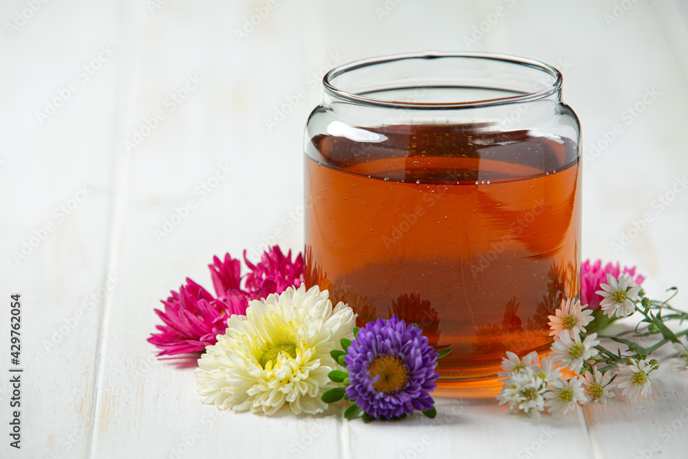 Delicious honey on white wooden backgroud Delicious honey on white wooden backgroud