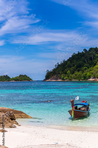 Beautiful Andaman sea, Tropical white sand beach and Turquoise clear blue sea and blue sky background at Lipe Island, Satun, Thailand - summer vacation travel