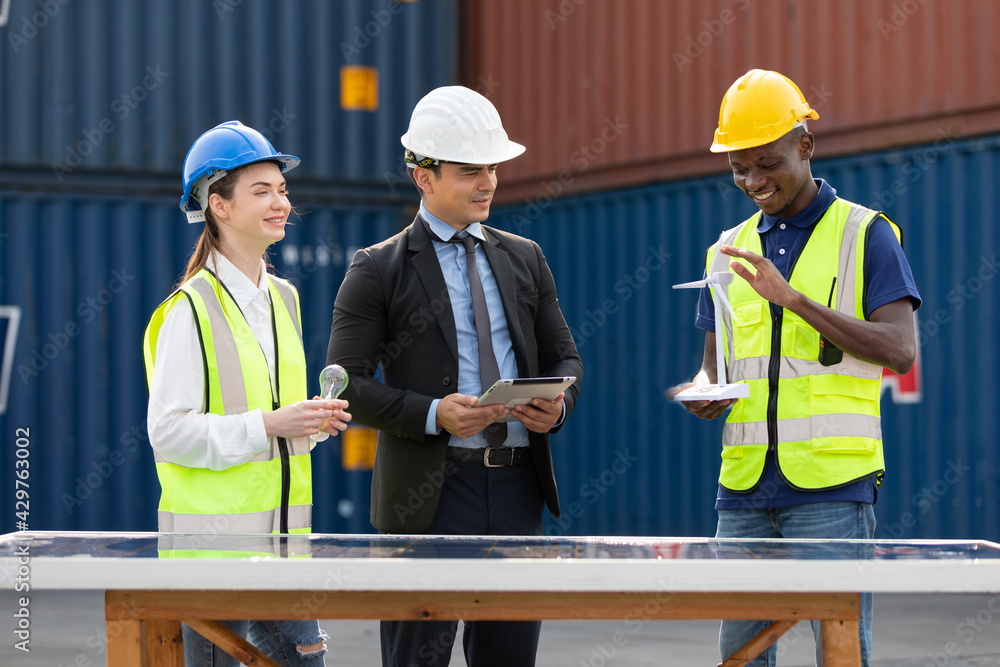 factory workers or engineers talking about project work in containers warehouse storage factory workers or engineers talking about project work in containers warehouse storage