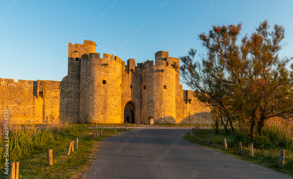 Gate and east ramparts, Aigues-Mortes in the early morning, in the Gard in Occitanie, France
