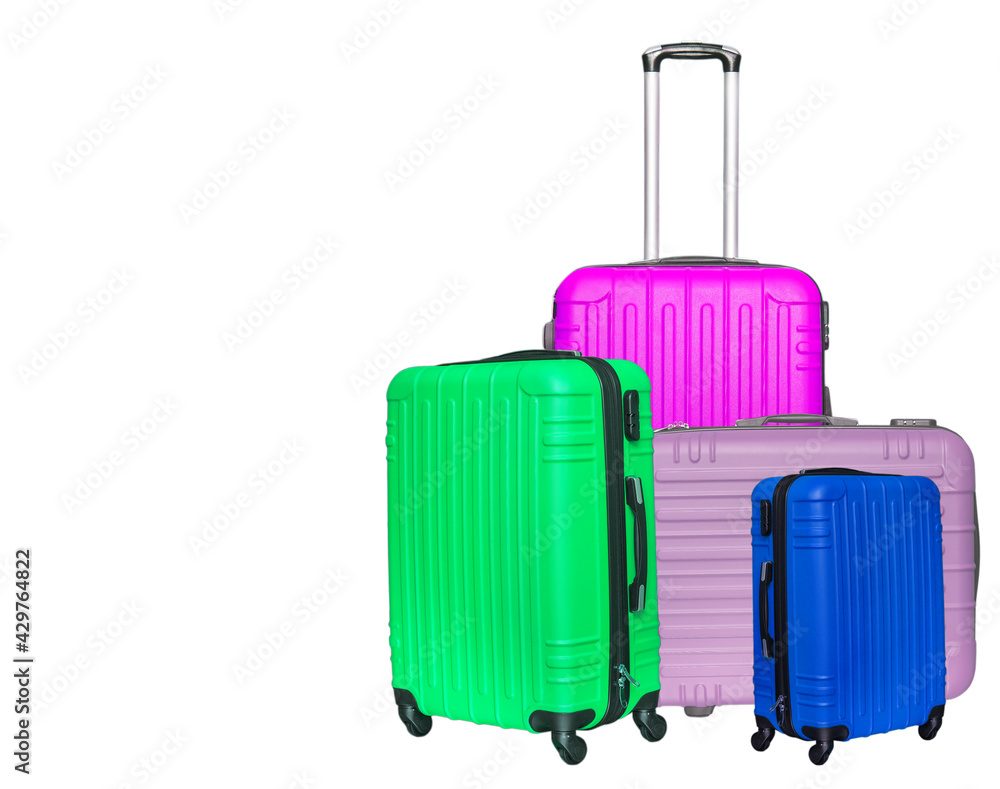 Colored suitcases on white background. Close up Colored suitcases on white background. Close up
