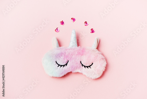 Bilde på lerret Pink sleeping eye mask on a pink background