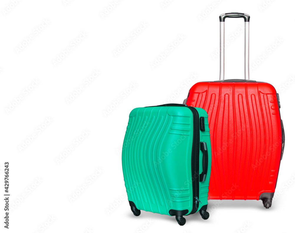 Colored suitcases on white background. Close up Colored suitcases on white background. Close up