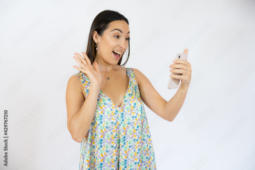 Cheerful young woman talking on mobile phone isolated over white background Cheerful young woman talking on mobile phone isolated over white background