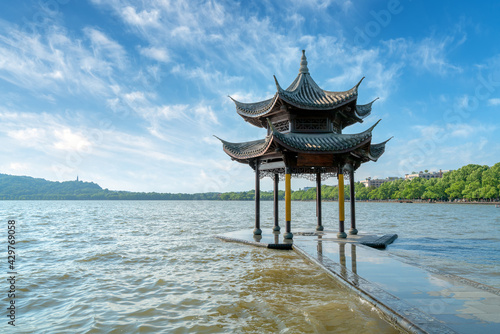 chinese ancient pavilion on the west lake in hangzhou.Translation:"Gathering the saint's pavilion"