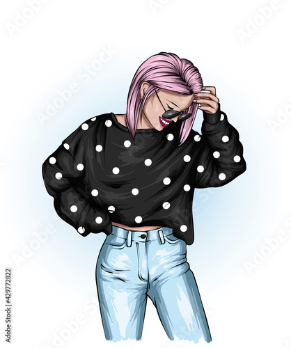 Beautiful girl in stylish jeans and a top. Fashion and style, clothing and accessories.