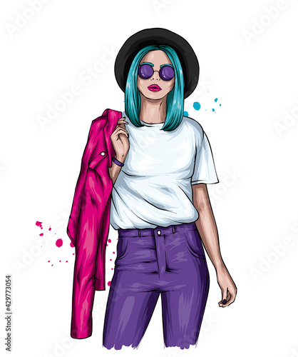 Beautiful girl in stylish clothes and a hat. Fashion and style, clothing and accessories.