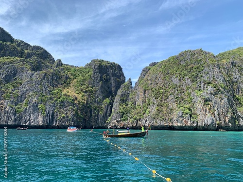 Landscape of Maya bay with long tail boat for tourist, Phi Phi island, Andaman sea, Krabi province, Thailand. The location of the film "The Beach". © Veruree