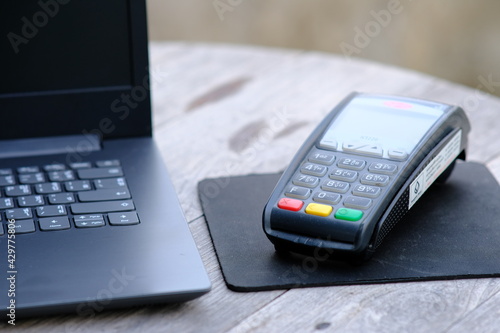 hand holding a credit card over edc machine and shoping payment concept