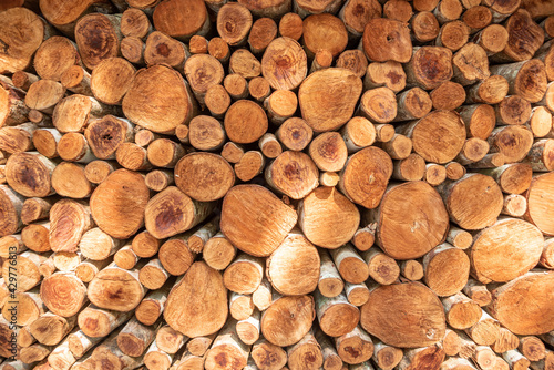 pile stacked natural sawn wooden logs background