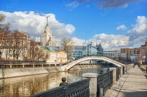 Photography View of a skyscraper on Kotelnicheskaya embankment and Sadovnichesky bridge in M