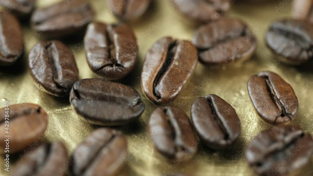 Roasted vietnamese coffee bean. Fragrant coffee beans scrolls slowly around the camera. Slow Motion Close Up of Whole Roasted Coffee Beans.High angle view. 4k Roasted vietnamese coffee bean. Fragrant coffee beans scrolls slowly around the camera. Slow Motion Close Up of Whole Roasted Coffee Beans.High angle view. 4k