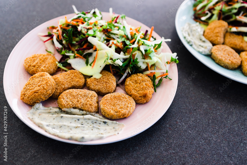 vegan nuggets with shredded salad and dairy-free sauces, healthy plant-based food vegan nuggets with shredded salad and dairy-free sauces, healthy plant-based food