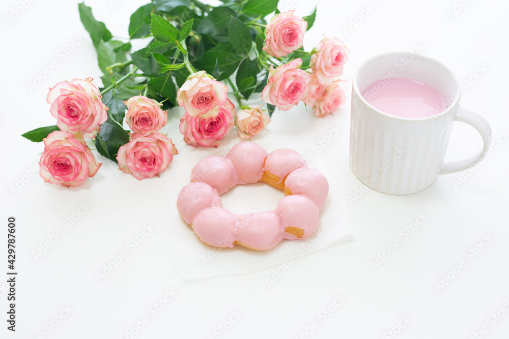 pink concept. donut, drink and rose