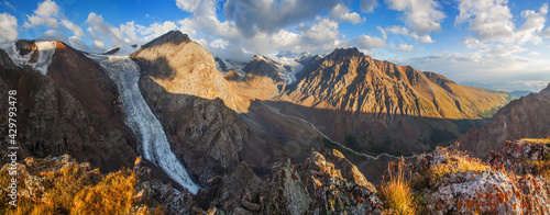 Panorama of Altai Mountains in morning light, rocky peaks and glaciers 