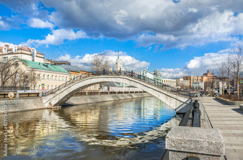 Photography View of a skyscraper on Kotelnicheskaya embankment and Sadovnichesky bridge in M