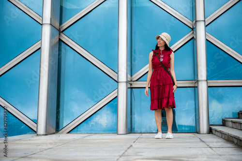 Asian woman in red dress at...