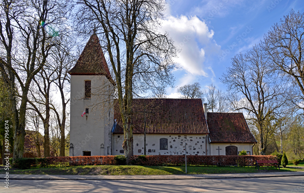 Currently erected in the 16th century, the Catholic Church of Saint Józef Rzemielnik in Nakomiady in Masuria, Poland. The photos show a general view of the temple.