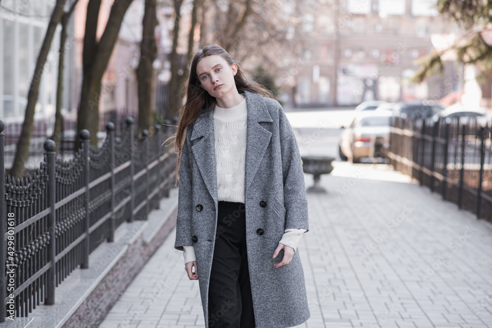 Portrait of an attractive girl on the street while walking Portrait of an attractive girl on the street while walking