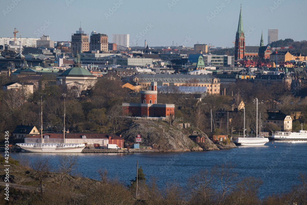 Morning water view over the island Kastellholmen with a castell and a Stockholm skyline