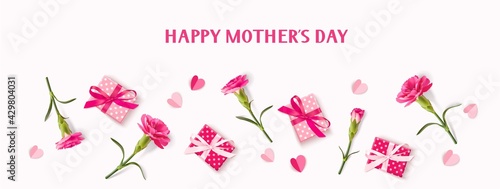 Happy Mothers day banner. Holiday design template with realistic pink carnation flowers, gift boxes and paper hearts on pink background. Vector stock illustration.