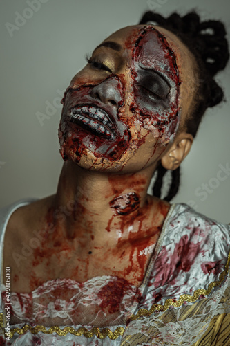 Fototapeta Naklejka Na Ścianę i Meble -  Model posing as a zombie halloween theme